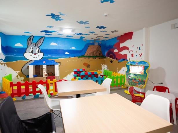 Children's play area with colorful decorations and interactive games.