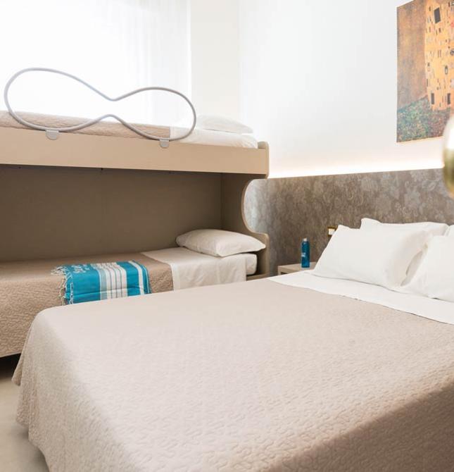Cozy room with beds and art, relaxing and warm atmosphere.
