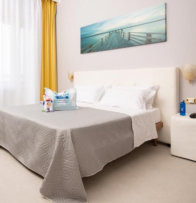 Bright room, cozy bed, serene and relaxing atmosphere.