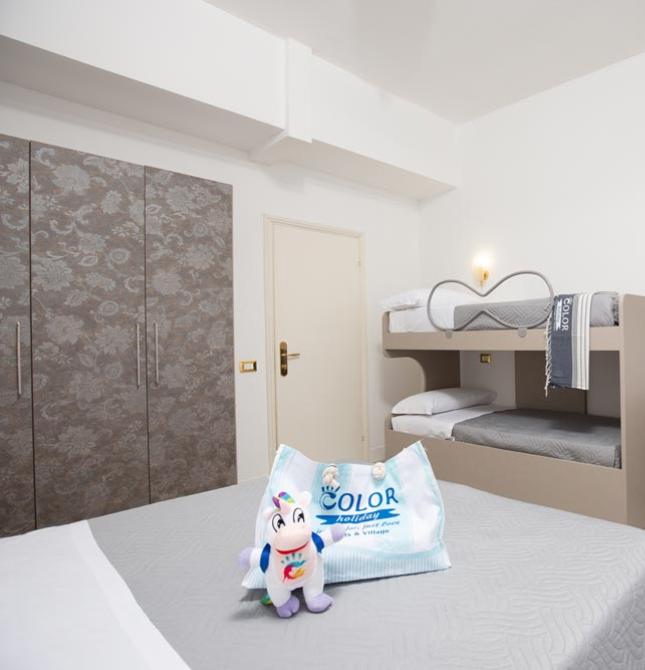 Bright room with bunk beds and cozy details.